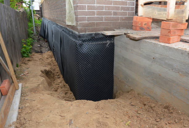 Happy homeowners after waterproofing job in Kilbourne